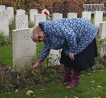 The Branch Secretary, Sylvia Revell, place a Cross of Remembrance on the grave of a Corps member.